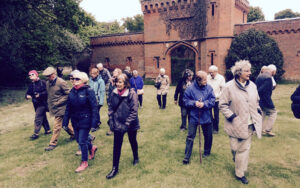 A group looking at the lost garden at Rougham Hall largely created in 1890's with introductory talks by Edward Martin and Sally Kington.