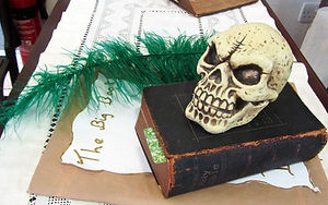Skull, book and green feather quill are all props from the Rougham School Summer Concert including shakespeare's plays